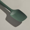 The GIR Sage Green Spoonula on a grey background.